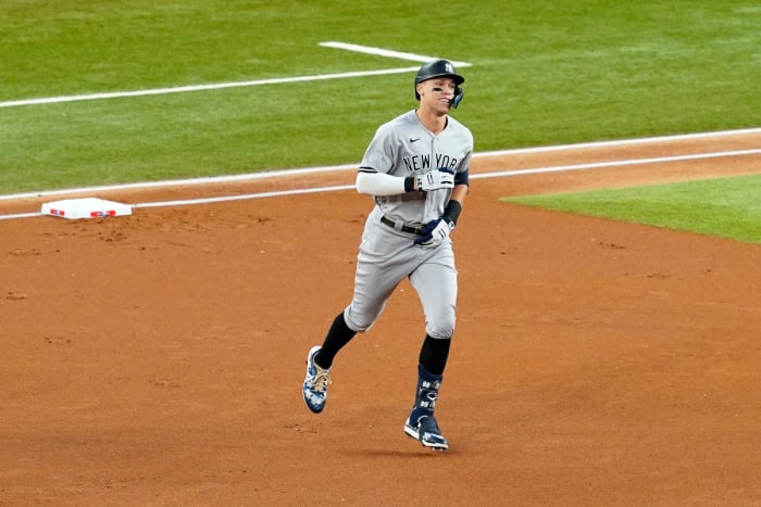 New York Yankees’ Aaron Judge rounds the bases after hitting a solo home run, his 62nd of the season, in the first inning of the second baseball game of a doubleheader against the Texas Rangers in Arlington, Texas, Tuesday, Oct. 4, 2022. With the home run, Judge set the AL record for home runs in a season, passing Roger Maris.